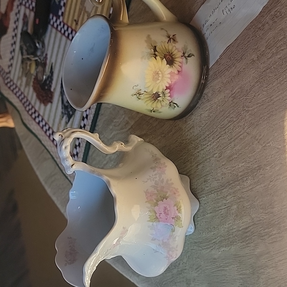 2 old small pitchers